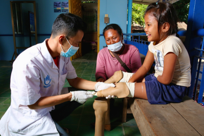 A young girl amputee taking part in a rehabilitation session.