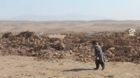Archive photo: Damage caused by three consecutive earthquakes that struck the province of Herat in Afghanistan in October 2023. A man walks in front of a field of bricks and stones, the remains of collapsed buildings.