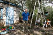 Mr. Volodymyr pictured in the yard of his home near the village of Zarazhne in Kharkiv Oblast. In February 2022 he was injured in a cluster munition strike on Kharkiv city and now has no feeling below his left thigh as a result of nerve damage. The strike, he says, was the first instance of cluster munitions in the war. When you are injured from cluster munitions he says, there is no end. He is a beneficiary of HI with cash assistance. Mr. Volodymyr pictured in the yard of his home near the village of Zarazhne in Kharkiv Oblast. In February 2022 he was injured in a cluster munition strike on Kharkiv city and now has no feeling below his left thigh as a result of nerve damage. The strike, he says, was the first instance of cluster munitions in the war. When you are injured from cluster munitions he says, there is no end. He is a beneficiary of HI with cash assistance.